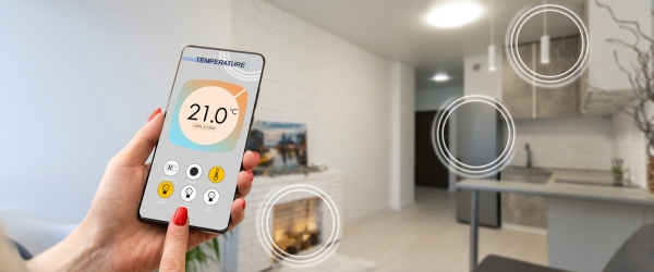 Close up focus on cellphone with smart home software application on screen, wireless light music temperature regulation with digital gadget, air conditioner climate control, iot, virtual assistant